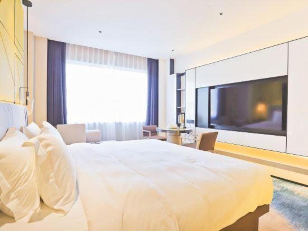 Fortune Hotel Лунъян Экстерьер фото